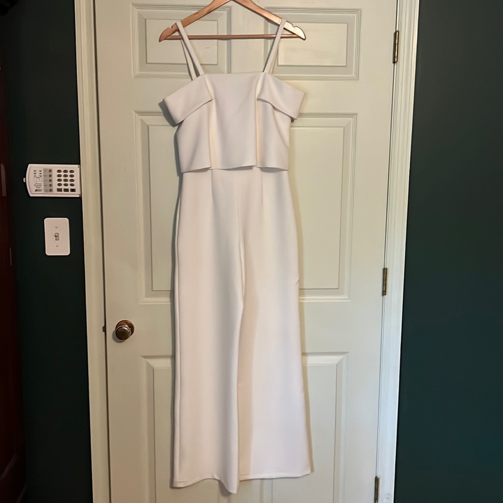 Wide leg, white tank top jumpsuit with zipper back.